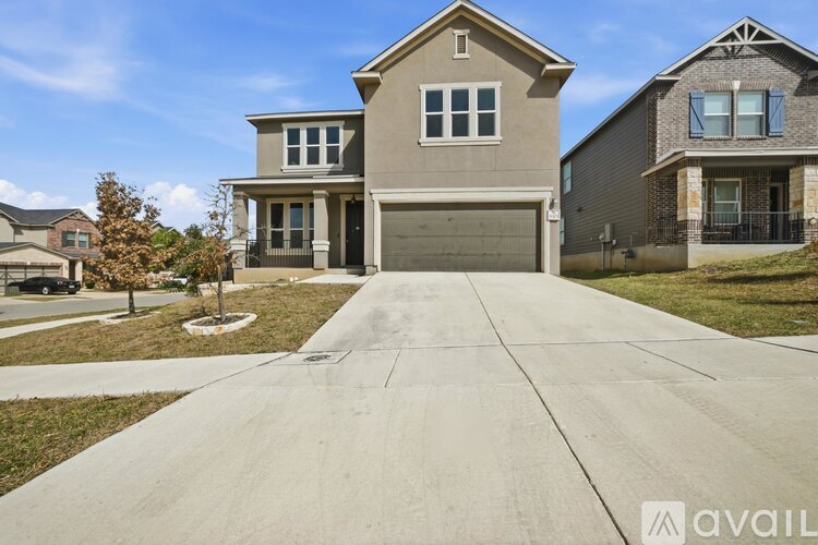 A house with a driveway in front of it is for sale.