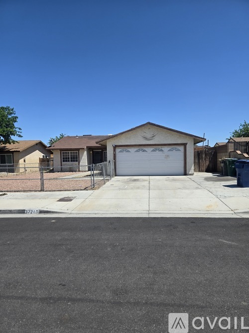 A house with a garage is for sale.