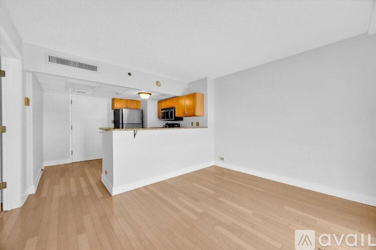 A kitchen with wooden cabinets and stainless steel appliances.