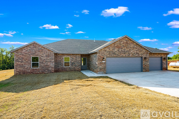 A house with a garage is for sale.