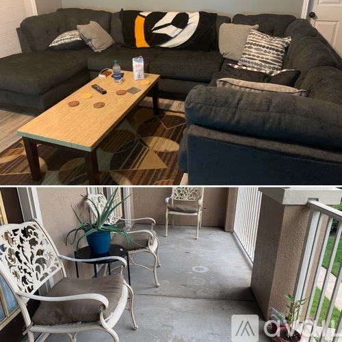 A living room with a grey couch and a wooden table.