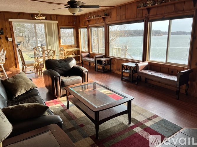A living room with a couch, chair, and a coffee table.