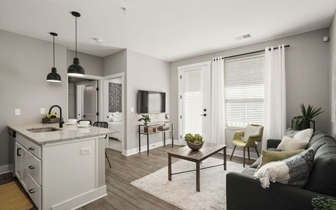 A modern kitchen with a dining table and chairs.