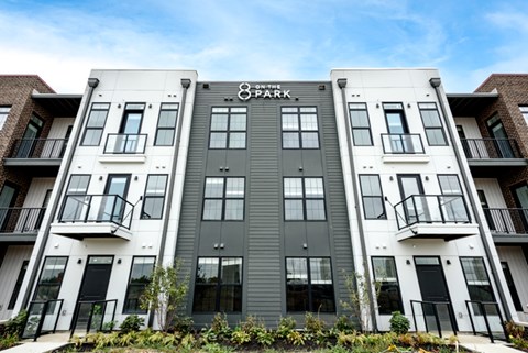 The image shows a modern building with the name "The Park" on the front.