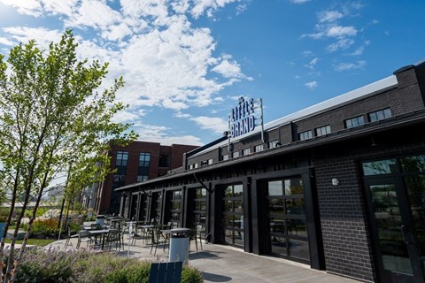 A building with a sign that reads "The Lake Bagot" is shown with a clear blue sky and some greenery in the foreground.