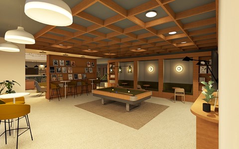 A room with a pool table and a yellow chair.