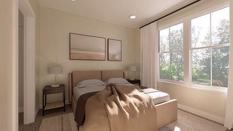A bedroom with a large bed and two framed pictures on the wall.