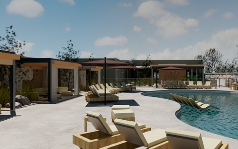 A modern outdoor pool area with sun loungers and a building.