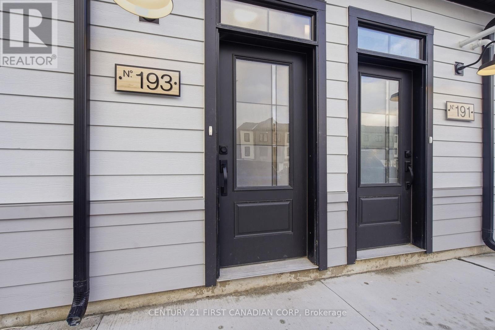 A white door is in a room with light colored walls.
