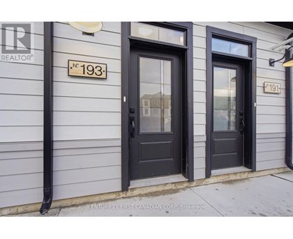 A white door is in a room with light colored walls.