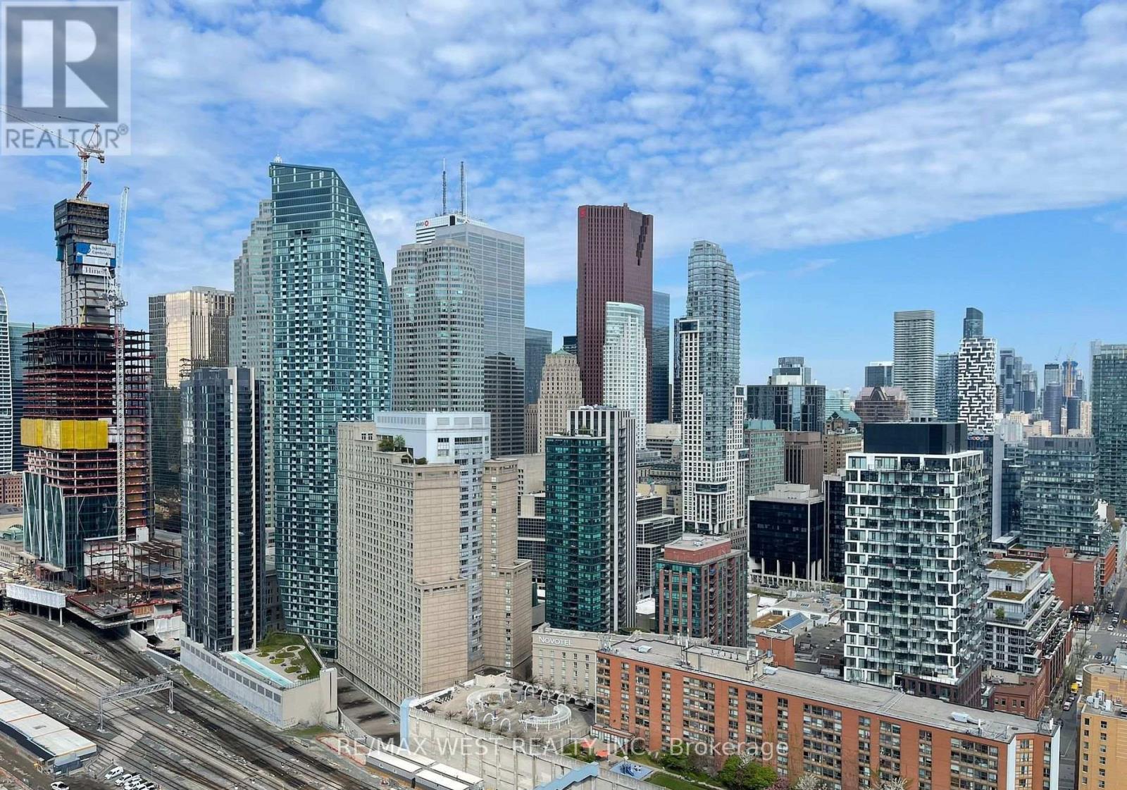 A cityscape with a Realty logo in the bottom left corner.