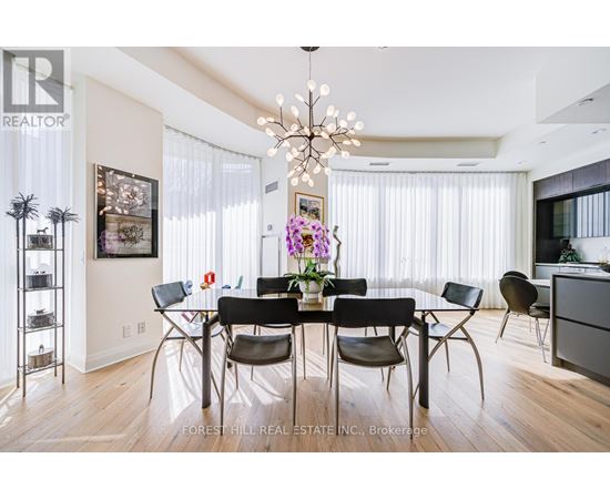 A dining room with a table set for six.