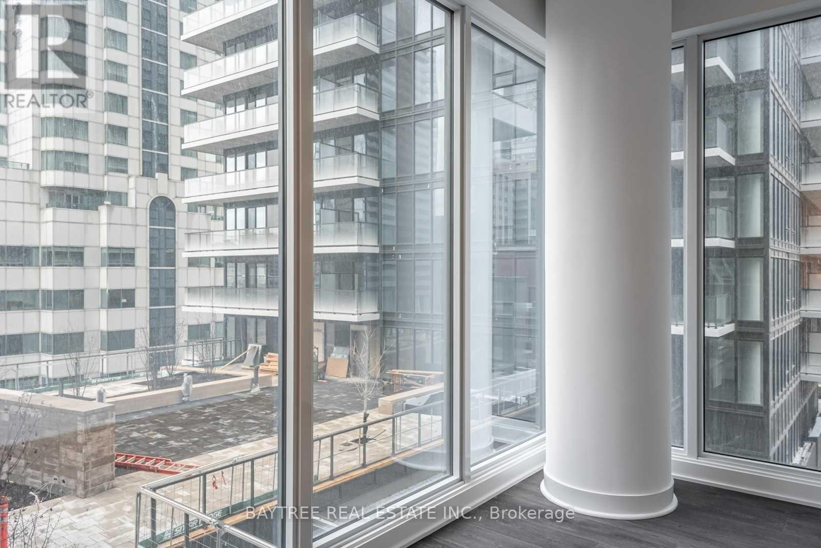 A view from inside a building looking out to a construction site.
