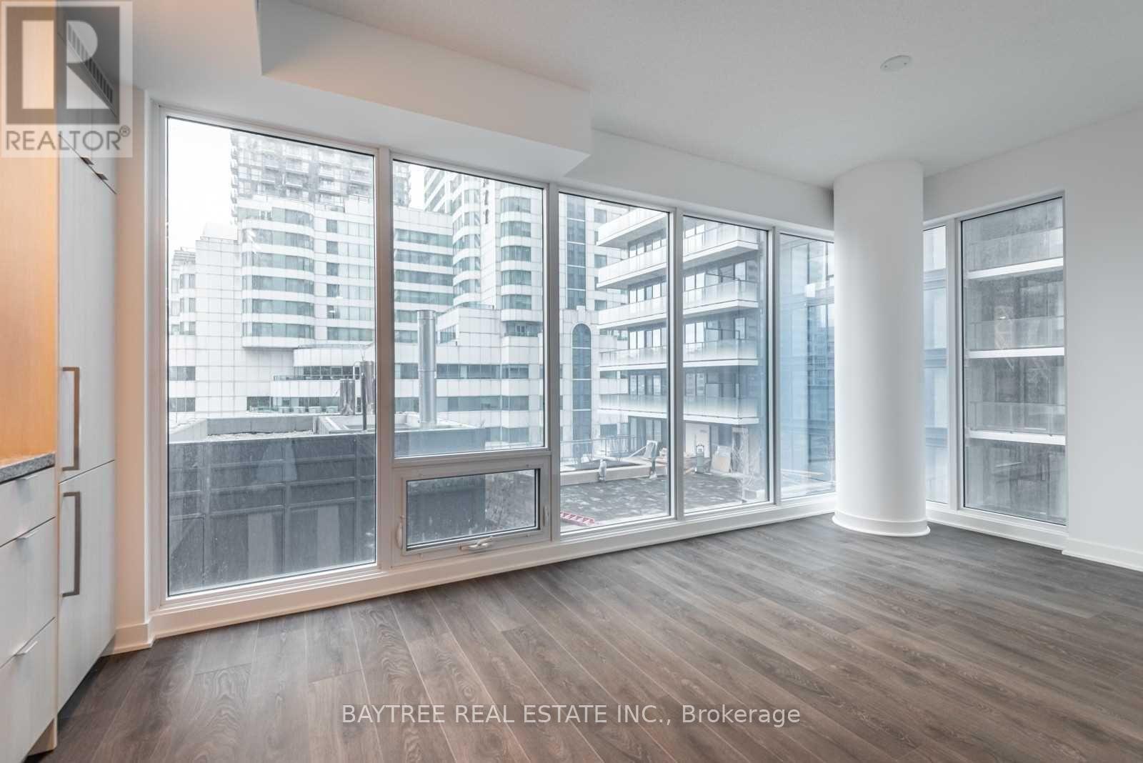 A real estate office is selling a property with a large window view.