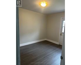 A room with a door and a window.