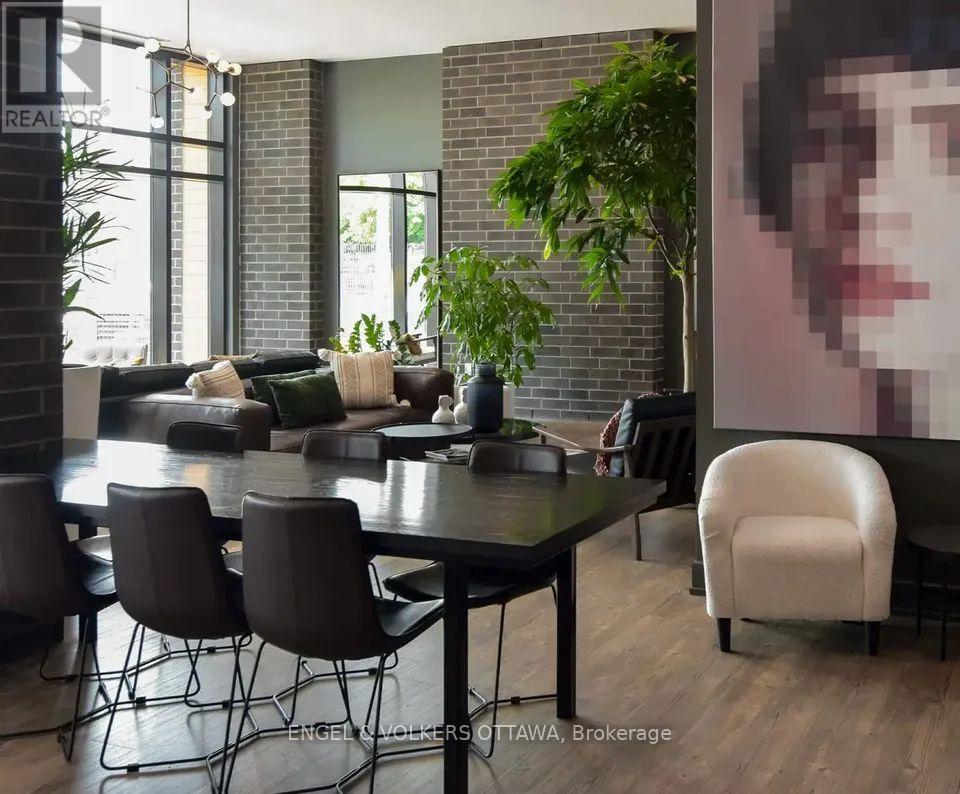 A modern dining room with a large table and chairs.