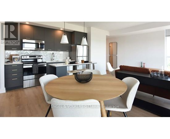 A modern kitchen with a wooden table and white chairs.