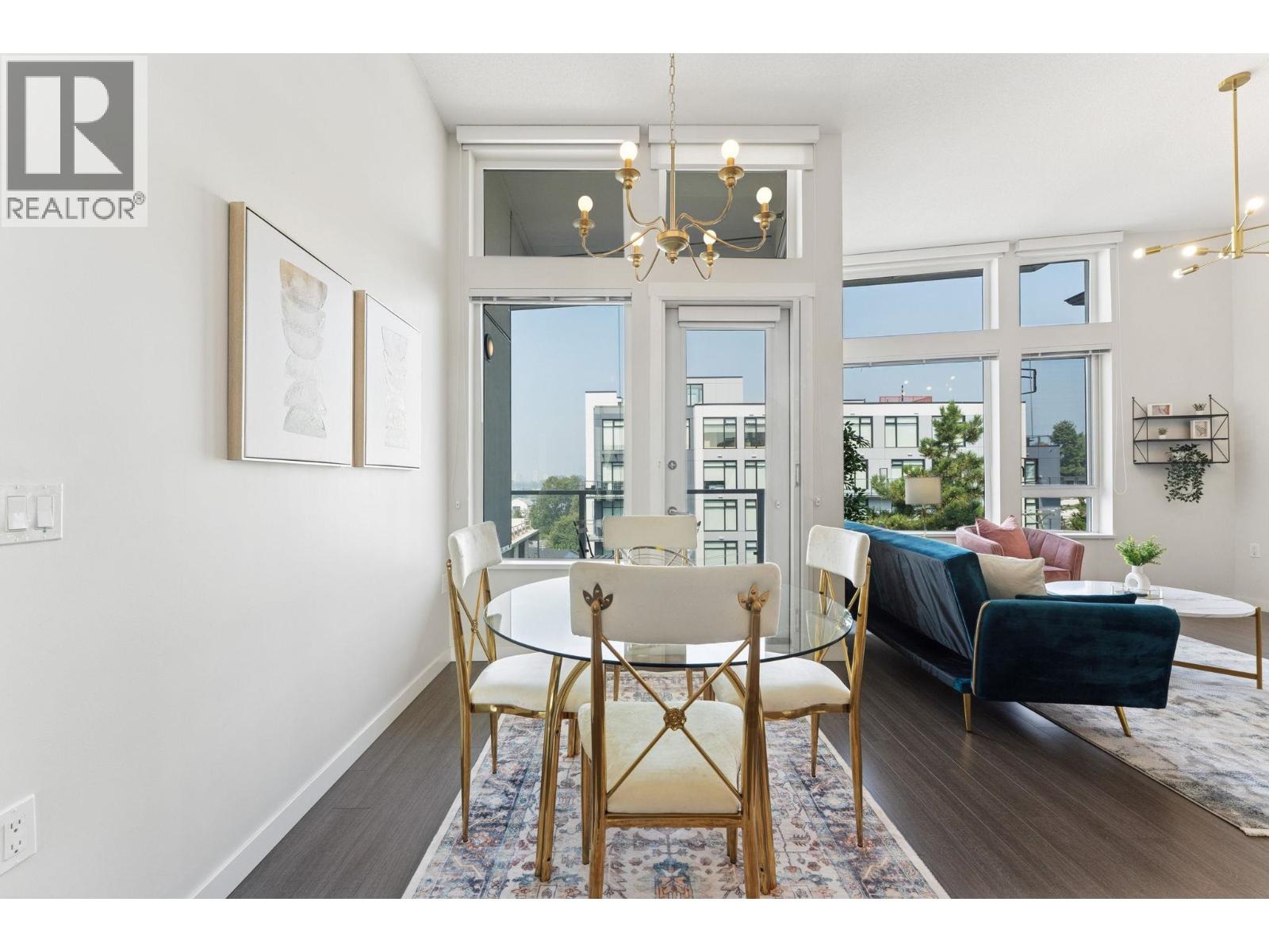 A well-lit dining room with a table set for four.