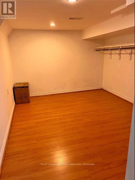A room with wooden floors and white walls.