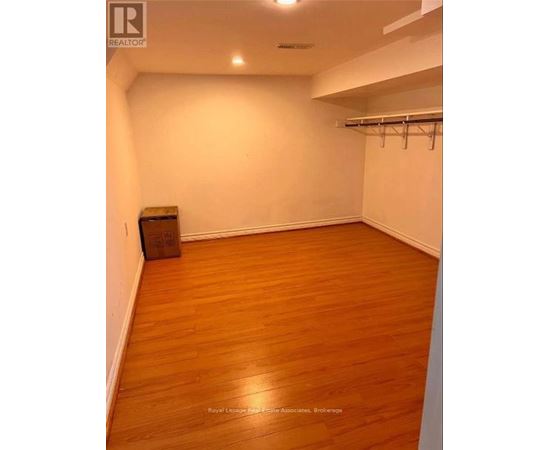 A room with wooden floors and white walls.