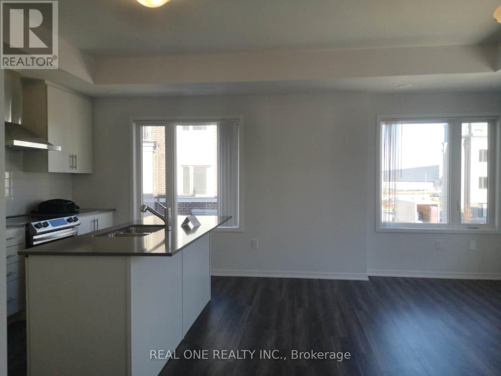 A kitchen with a sink and a window.