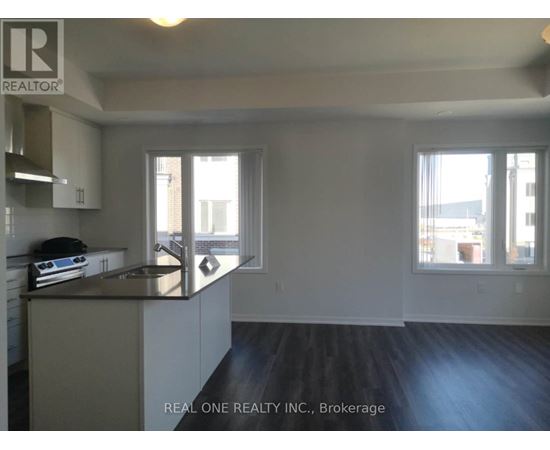 A kitchen with a sink and a window.