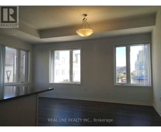 A room with a black countertop and a large window overlooking a cityscape.