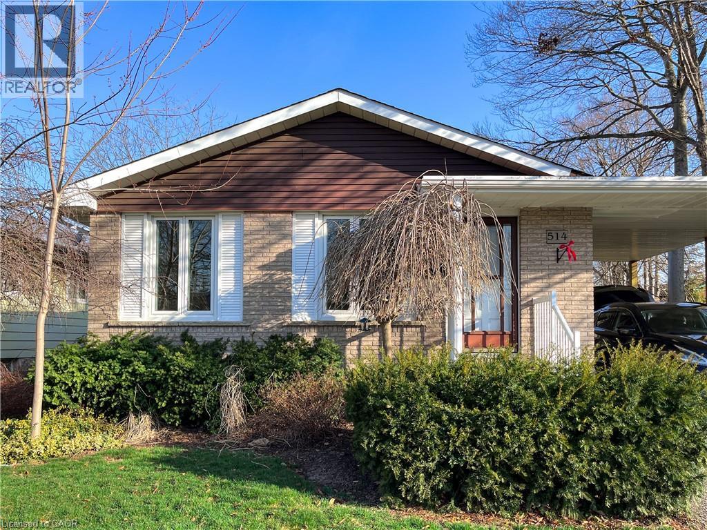 A house with a brown roof and white trim is for sale.