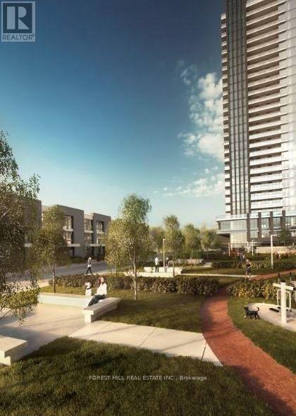 A modern residential area with a tall building on the right and a park in the foreground.