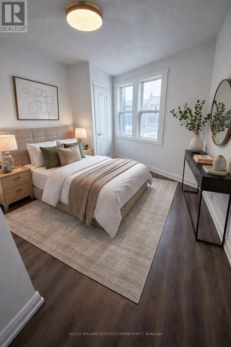 A bedroom with a large bed and a mirror on the wall.