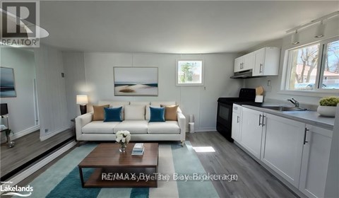 A modern living room with a white couch and a coffee table.