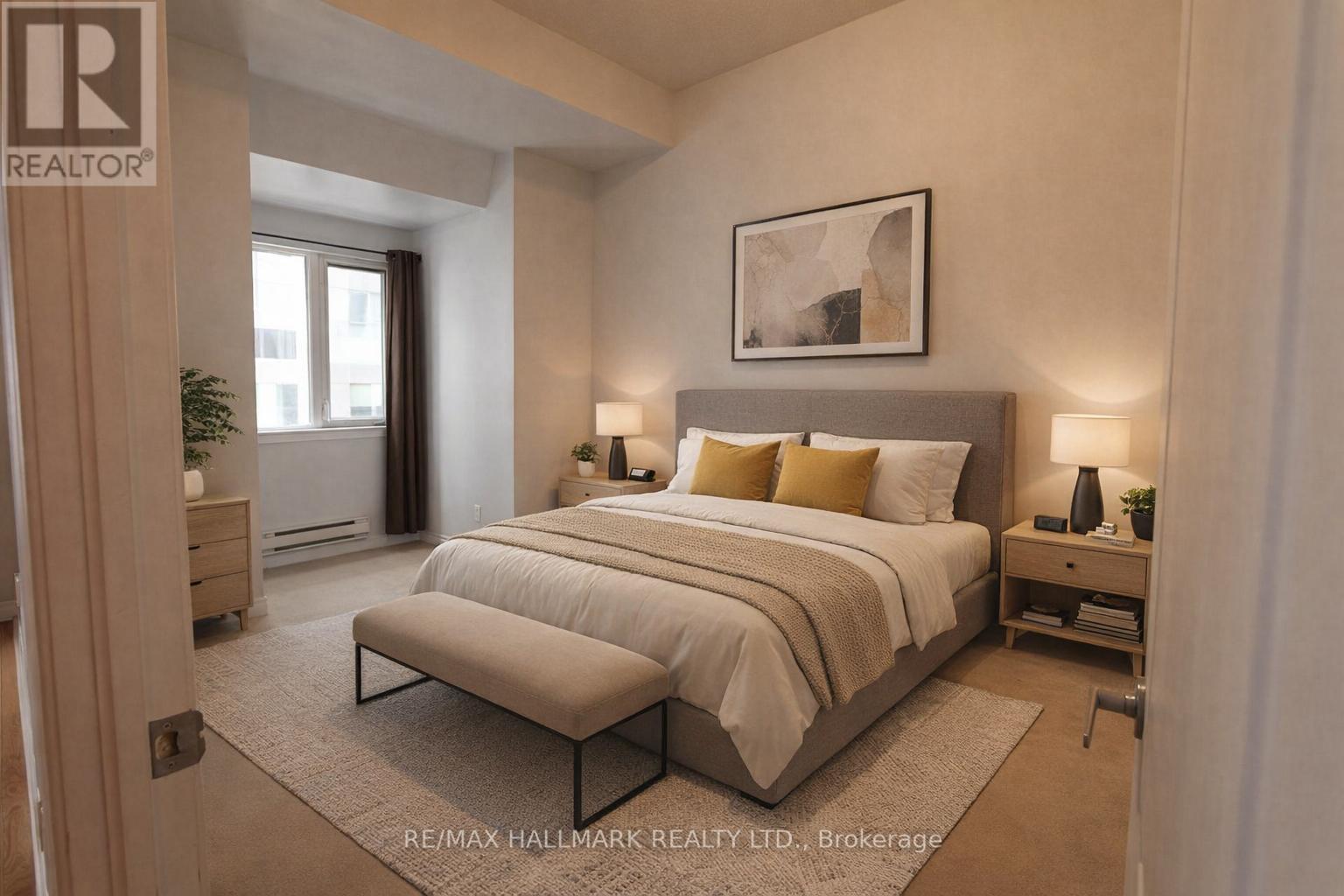 A bedroom with a large bed and a bench in front of it.