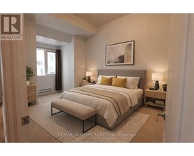 A bedroom with a large bed and a bench in front of it.