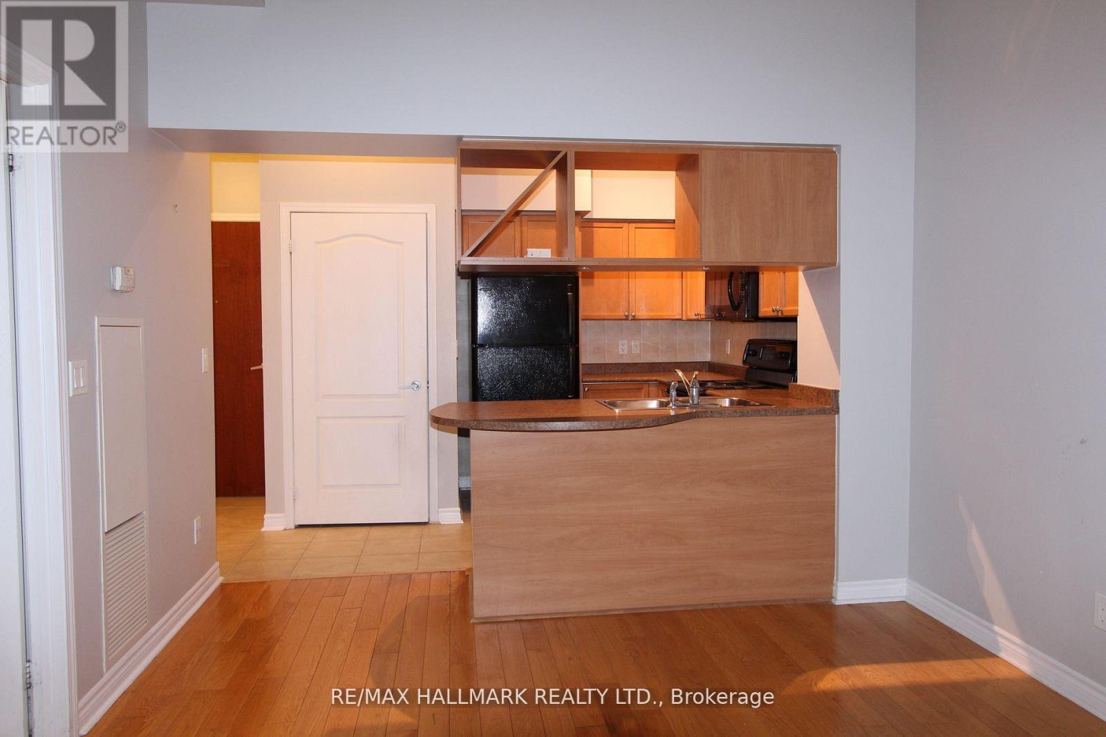 A kitchen area with a sink and a counter.