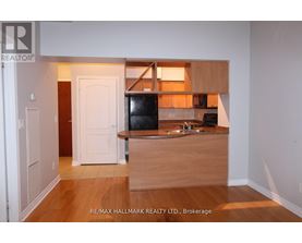 A kitchen area with a sink and a counter.