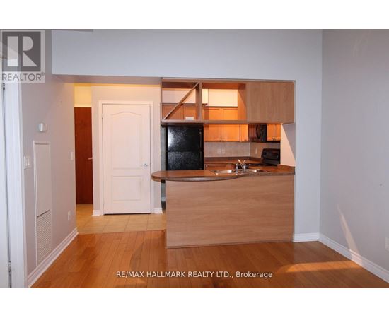 A kitchen area with a sink and a counter.