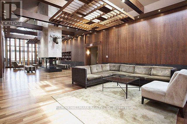 A living room with a long couch and a coffee table.