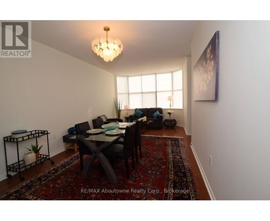 A dining room with a table set for six people.