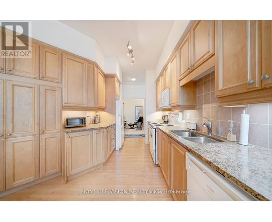 A kitchen with wooden cabinets and a white countertop.