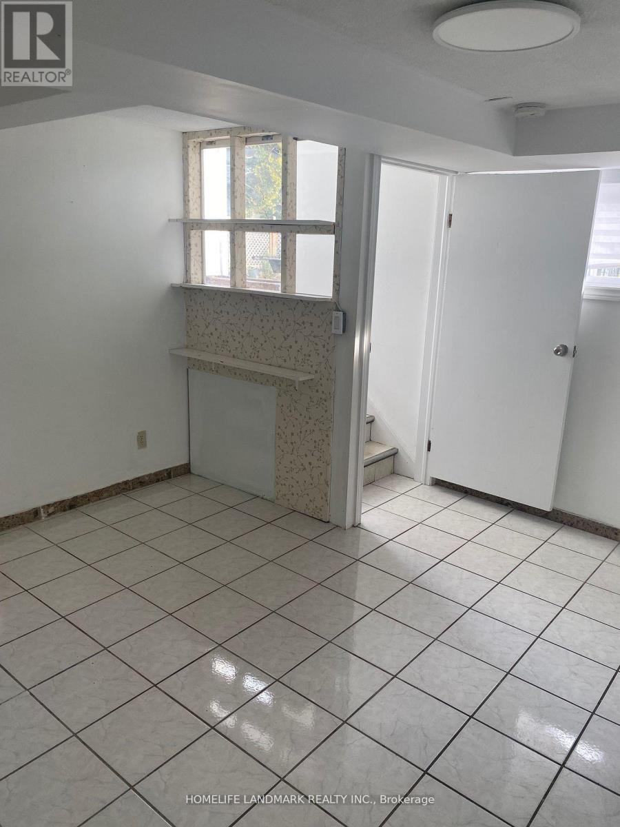 A tile floor in a room with a window and a door.