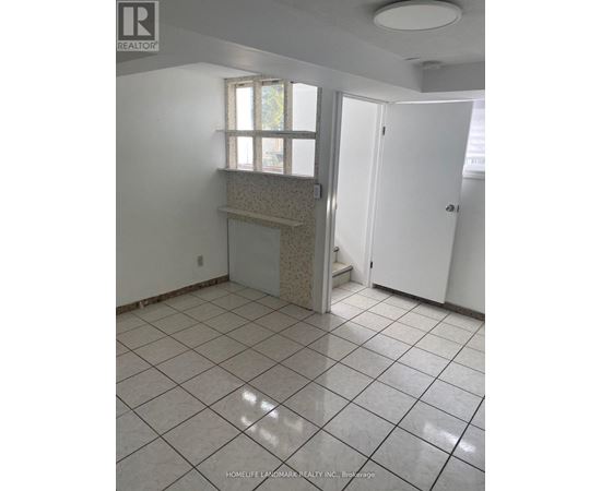 A tile floor in a room with a window and a door.