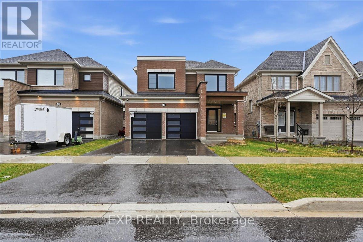 A real estate photo of a house with a truck parked in front.