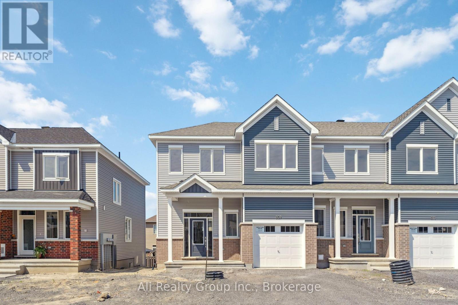 A row of houses with the logo "R" on the top left corner.