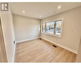 A room with a window showing a snowy landscape outside.