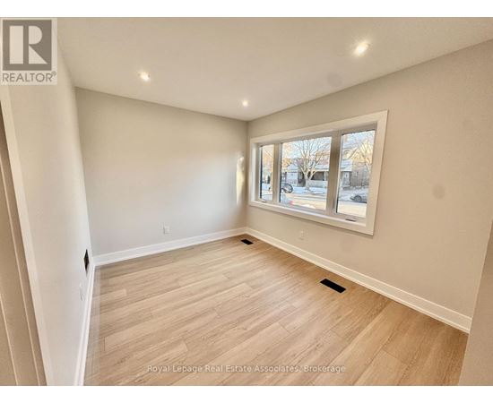 A room with a window showing a snowy landscape outside.