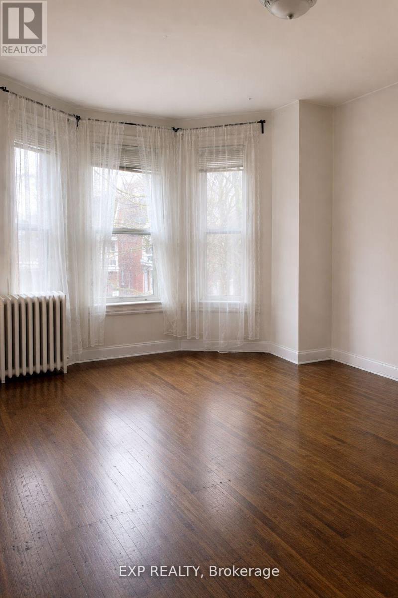 A room with wooden floors and white walls.