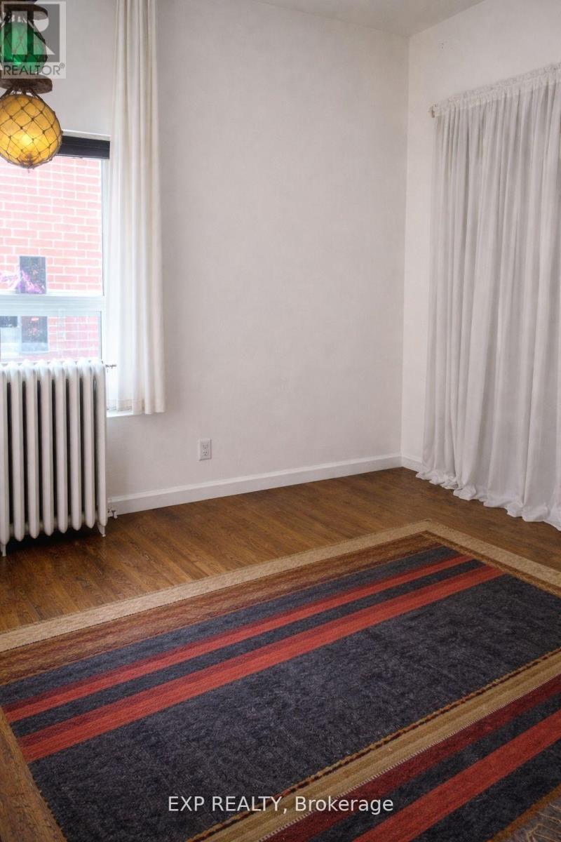 A room with a window and a radiator.
