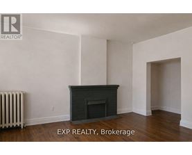 A room with a fireplace and a radiator.