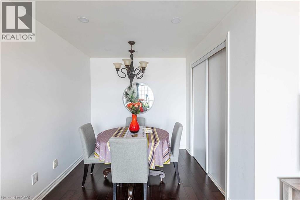 A dining room with a table set for two.