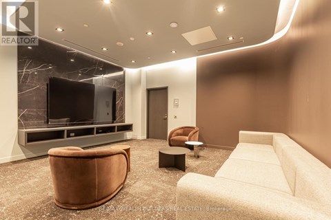 A living room with a brown leather chair and a white sofa.